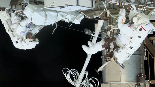 NASA ASTRONAUTS MCCLAIN AND AYERS REENTER STATION AND COMPLETE SPACEWALK