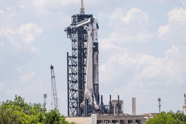 CUMULUS CLOUDS SCRUB LAUNCH OF CREW-11 MISSION TO THE SPACE STATION