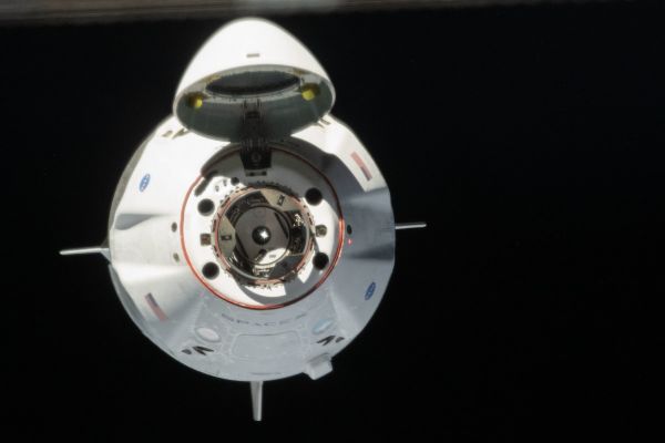 NASA AGREES TO FLY ASTRONAUTS ON REUSED CREW DRAGON SPACECRAFT