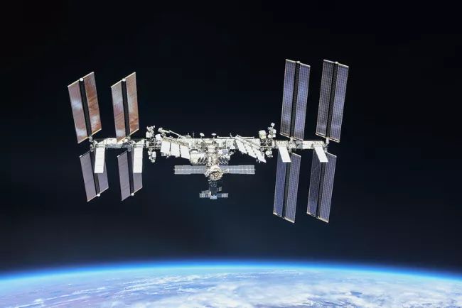 ASTRONAUTS TAKE SHELTER AS SPACE STATION DODGES ORBITAL JUNK