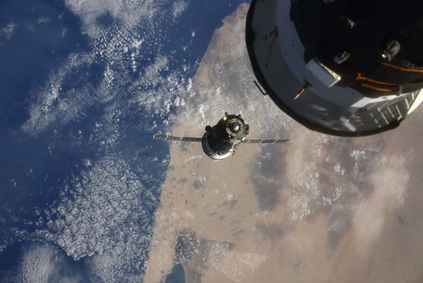 SOYUZ CREW DOCKS WITH INTERNATIONAL SPACE STATION