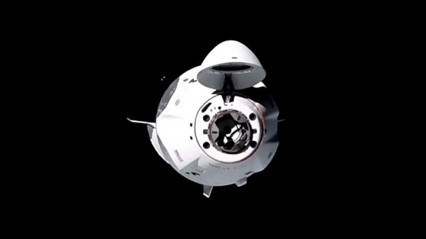 SPACEX CREW DRAGON CAPSULE DOCKS AT SPACE STATION WITH ITS 1ST CREW OF 4