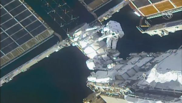 SPACEWALKING ASTRONAUTS PREPARE INTERNATIONAL SPACE STATION FOR NEW SOLAR ARRAYS