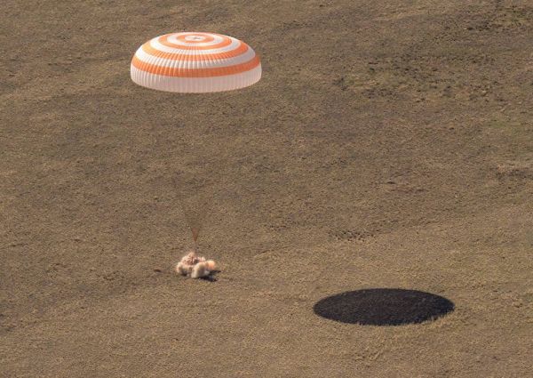 RUSSIAN CAPSULE BRINGS HOME THREE SPACE FLIERS