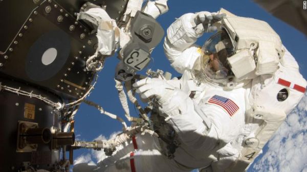 DEBRIS WARNING POSTPONES NASA SPACEWALK