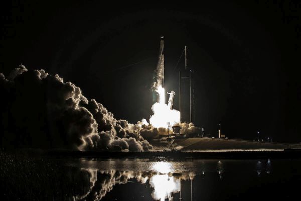 SPACEX ROCKET BOOSTS U.S.-RUSSIAN-EMIRATI CREW INTO ORBIT