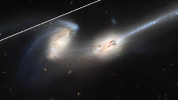 THIS NEW TOOL 'CLEANS' ANNOYING SATELLITE TRAILS FROM HUBBLE TELESCOPE PHOTOS